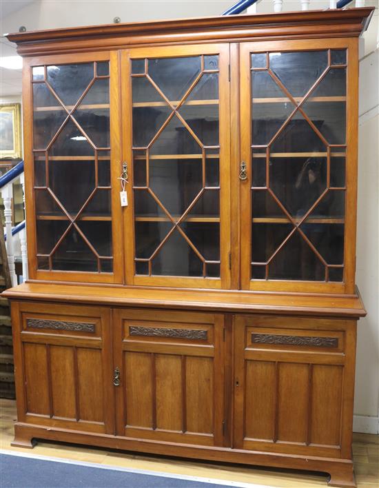 An Edwardian walnut bookcase W.180cm H.215cm